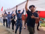 Kirab Merah Putih Raksasa Sukses Dikibarkan di Tebing Tugu Garuda Jagoi Abang
